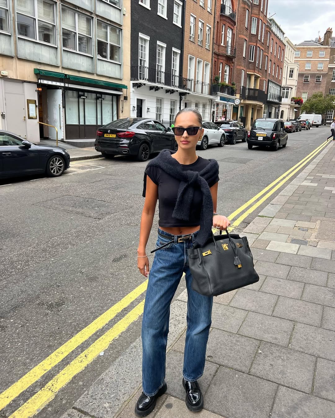 woman wearing fall loafer outfit idea 2025