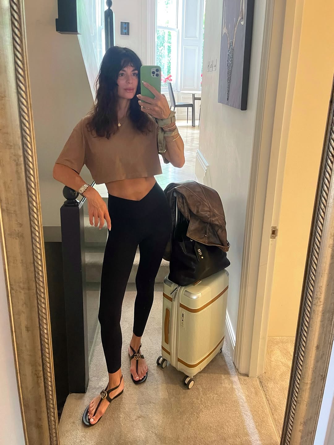 Woman wearing chic airport outfit 2025.