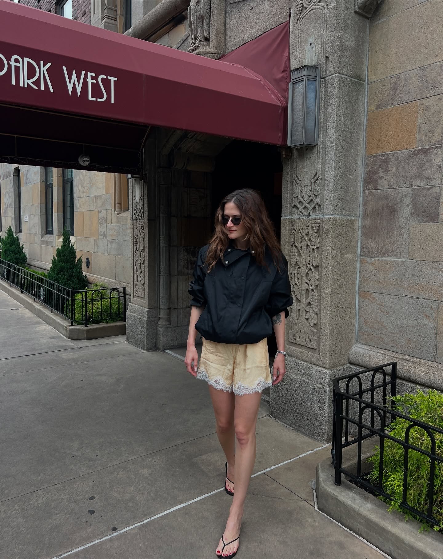 a woman wears satin shorts