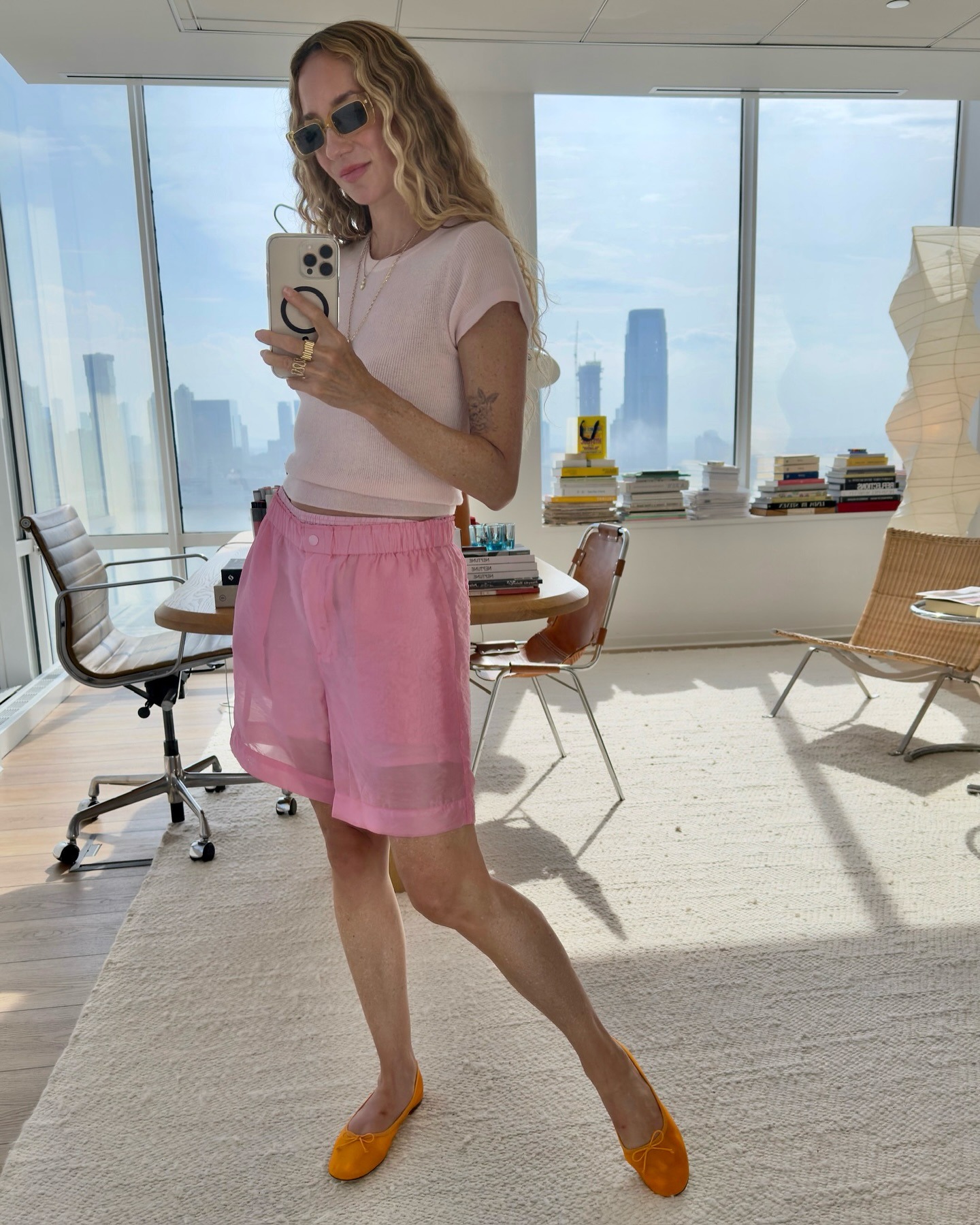 a woman wears pink shorts