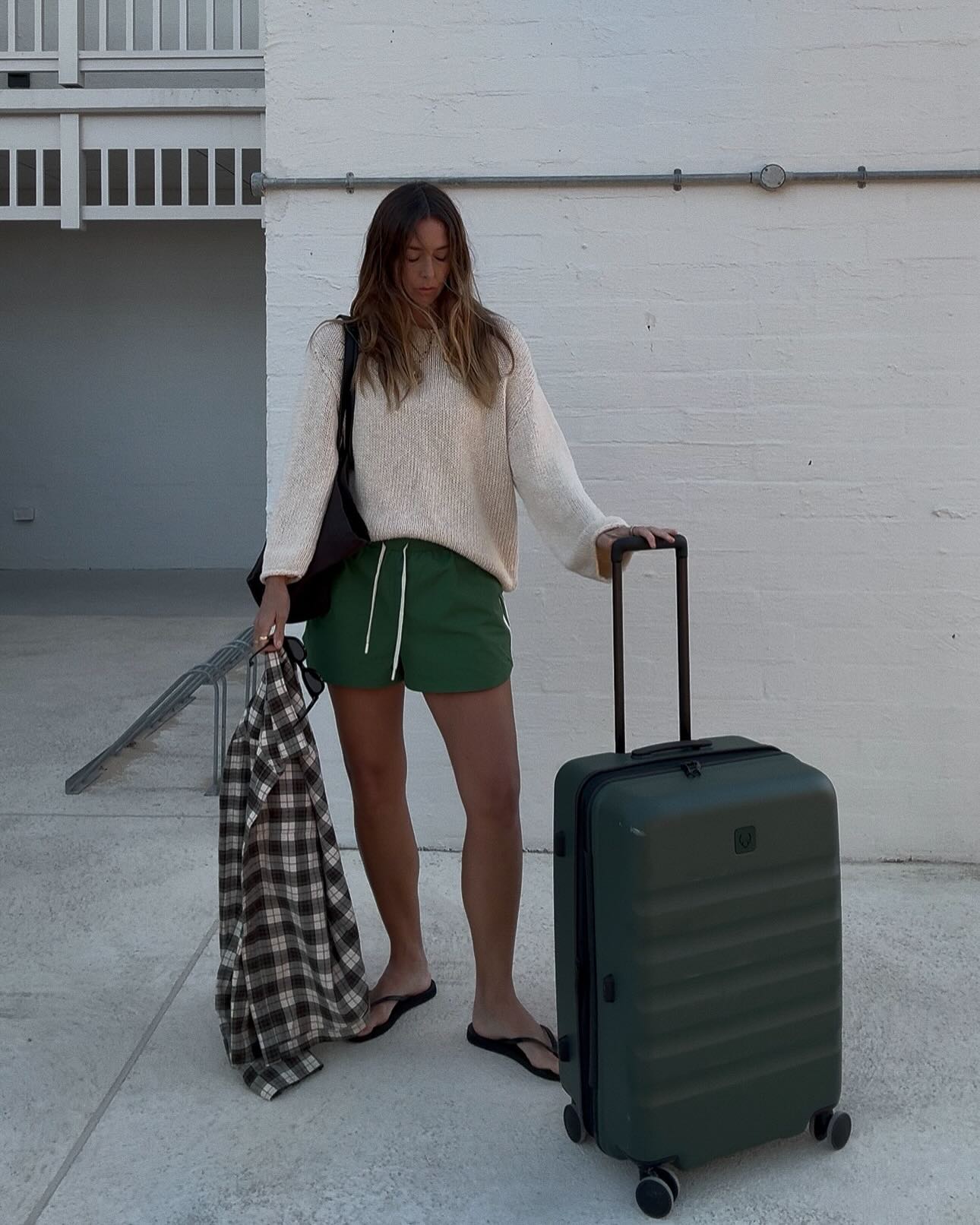 Woman wearing chic airport outfit 2025.