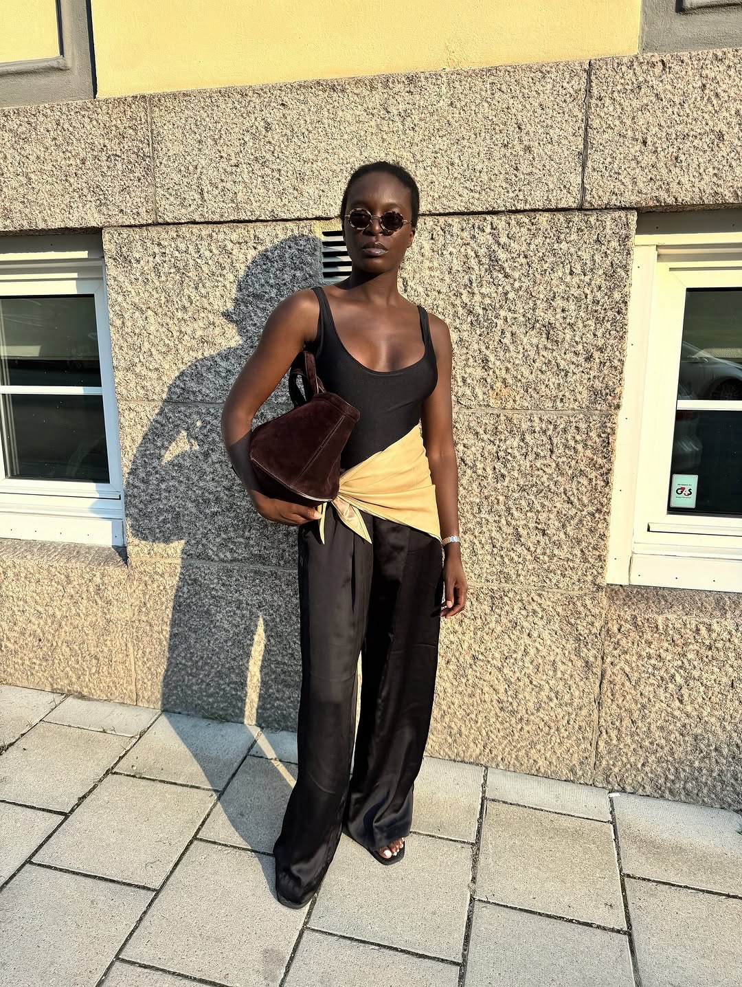 woman wearing scarf belt early fall 2025 fashion trends