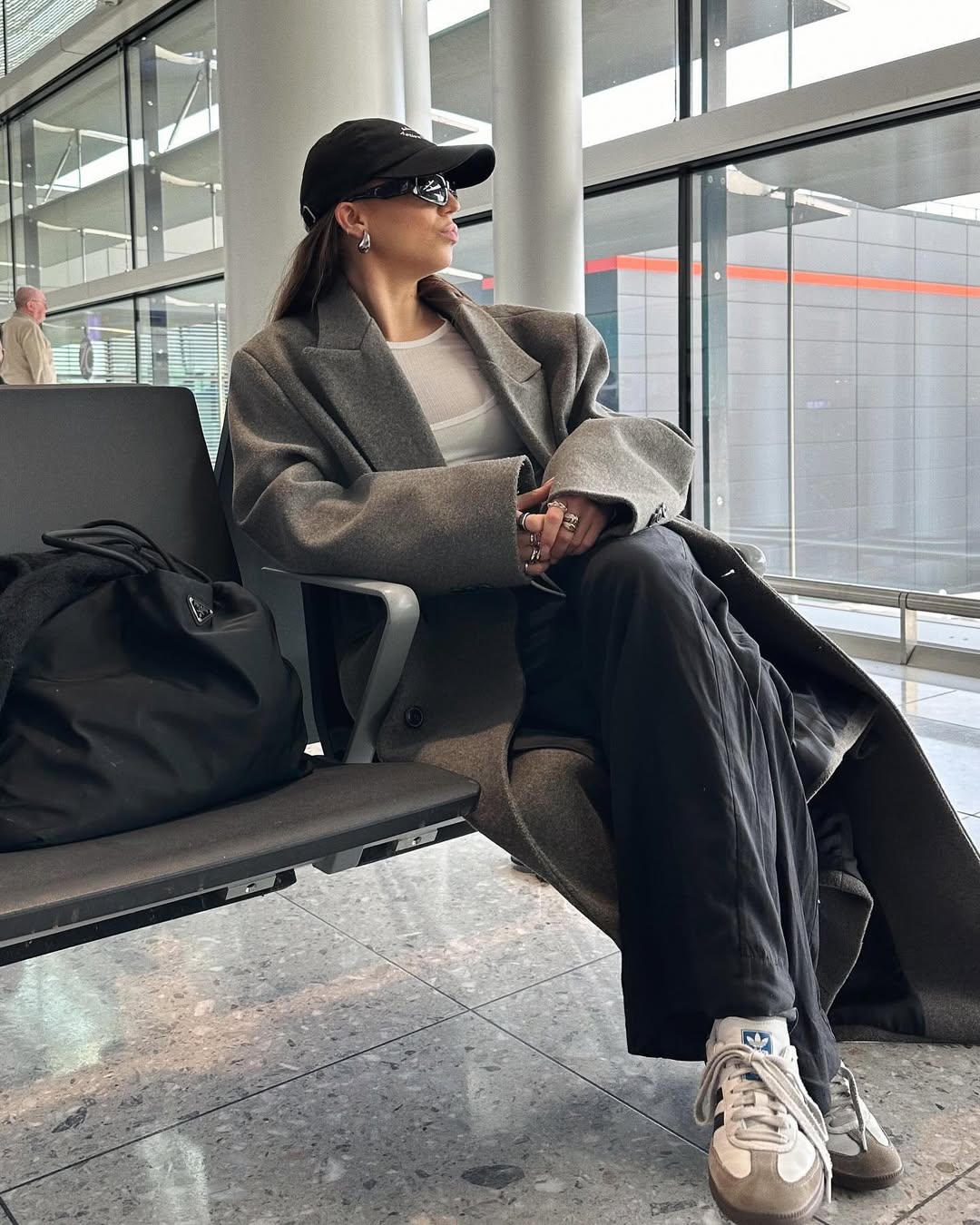 Woman wearing chic airport outfit 2025.