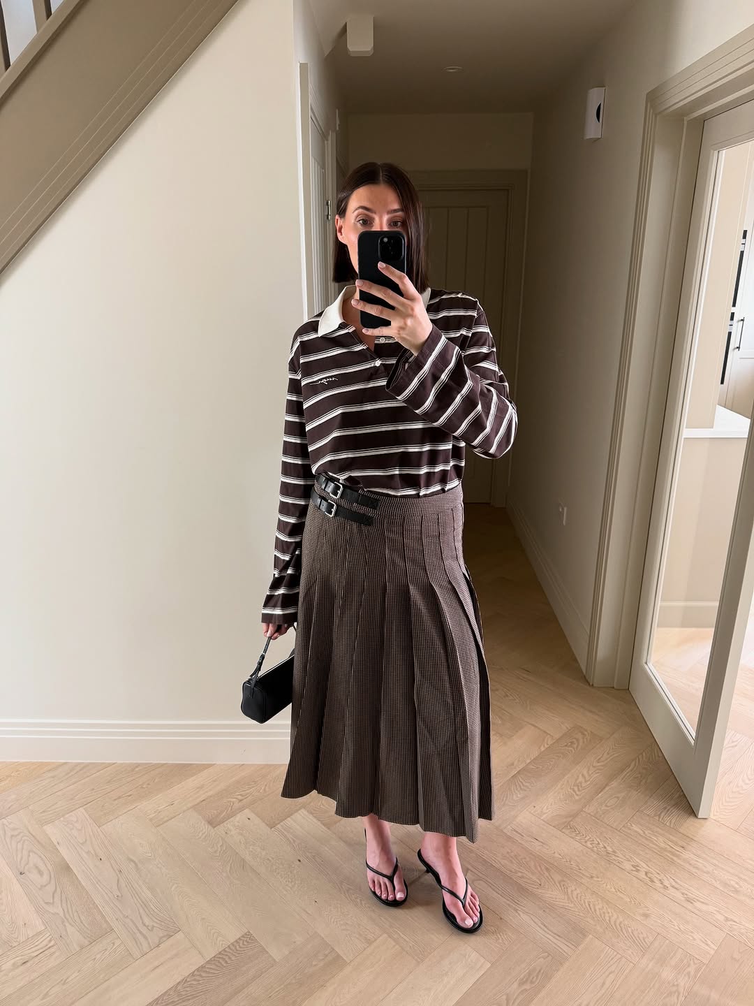 woman wearing striped polo top outfit