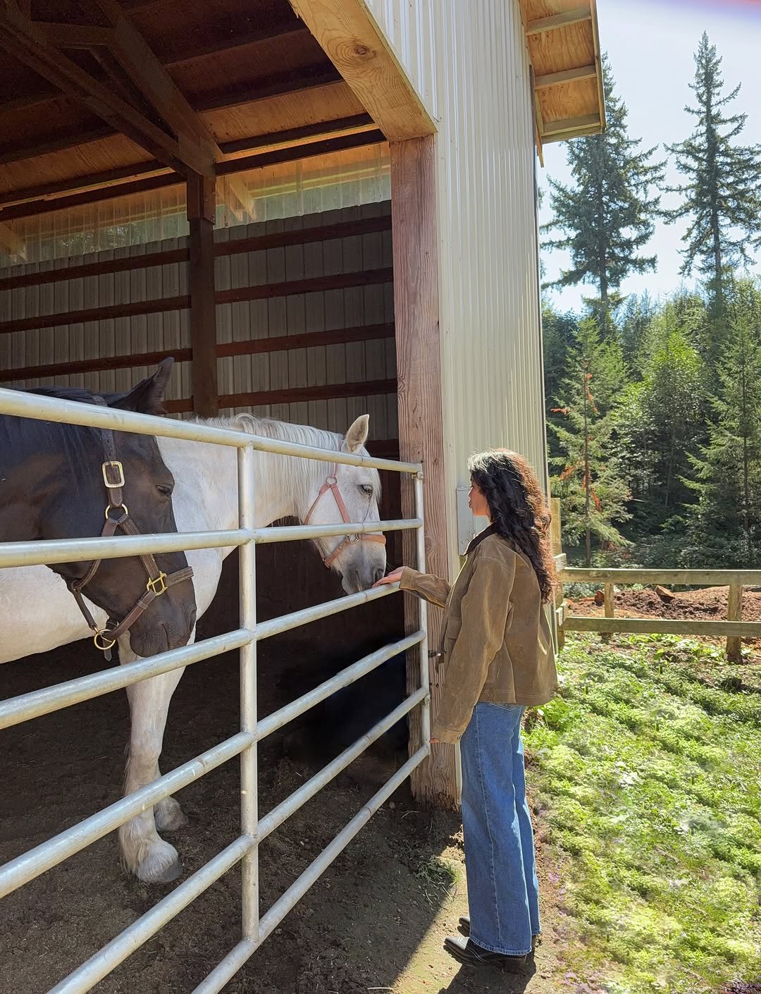 Woman wearing a tan jacket with jeans in a fall 2025 outfit.
