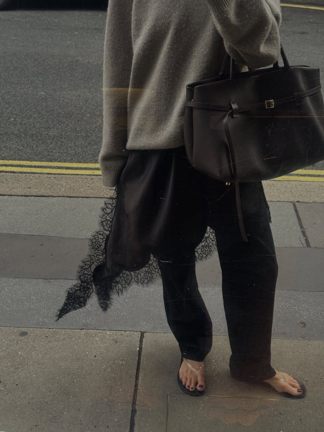 Woman wearing black lace going out top.