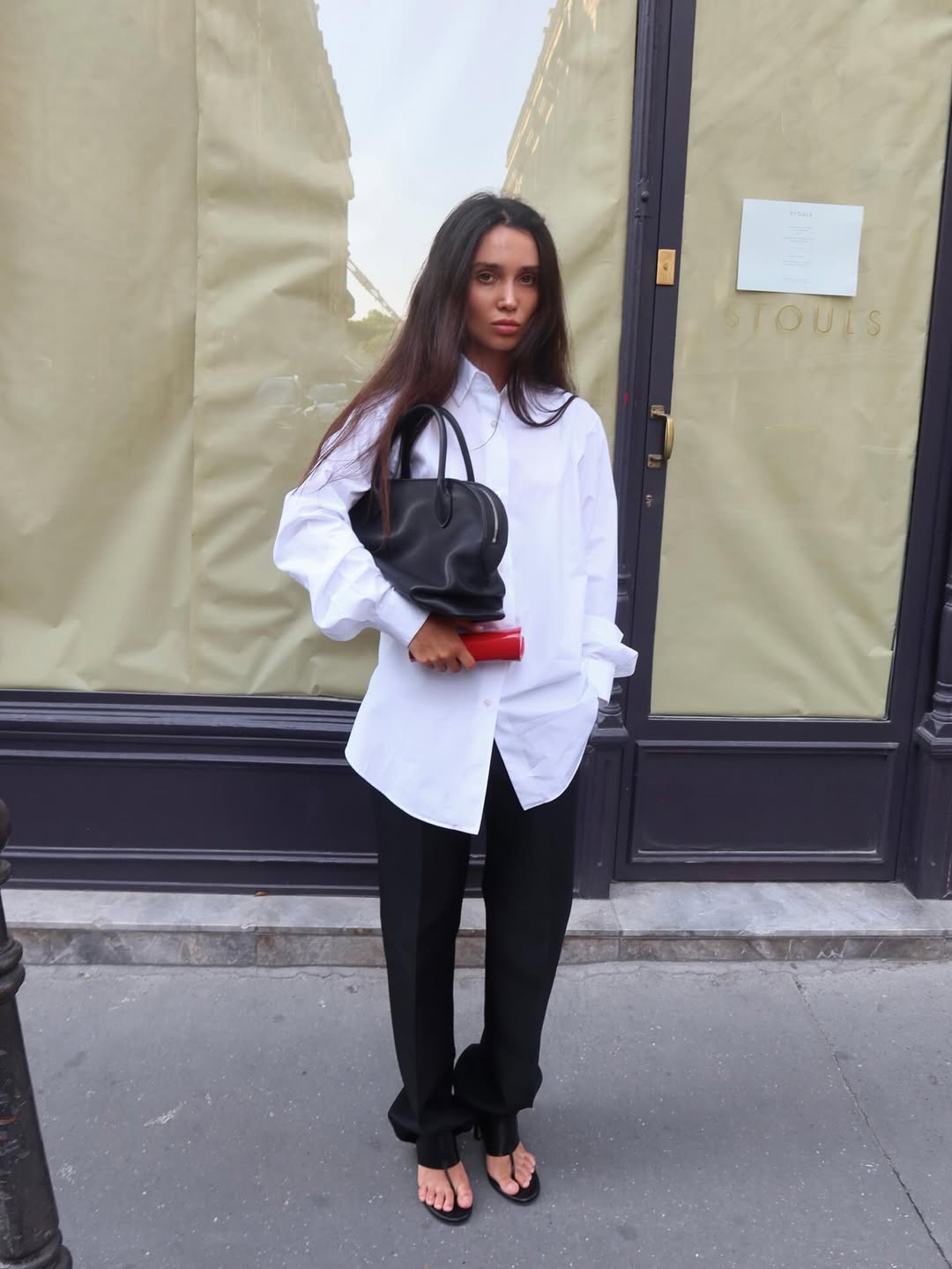 an outfit featuring a white shirt with black trousers and heeled thong sandals