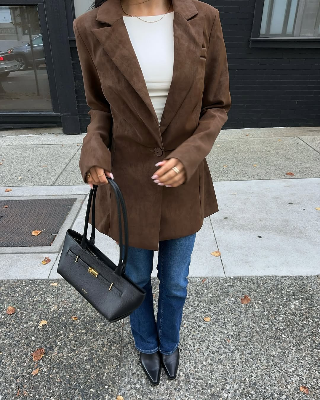 woman wearing fall denim skinny-ish jean trend 2025