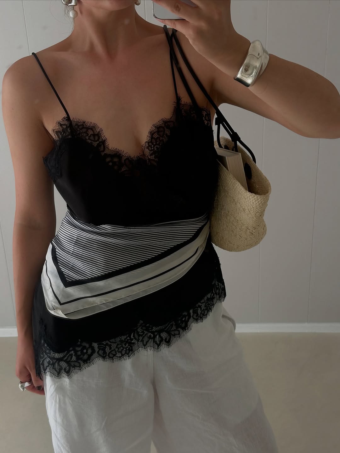 Woman wearing black lace going out top.