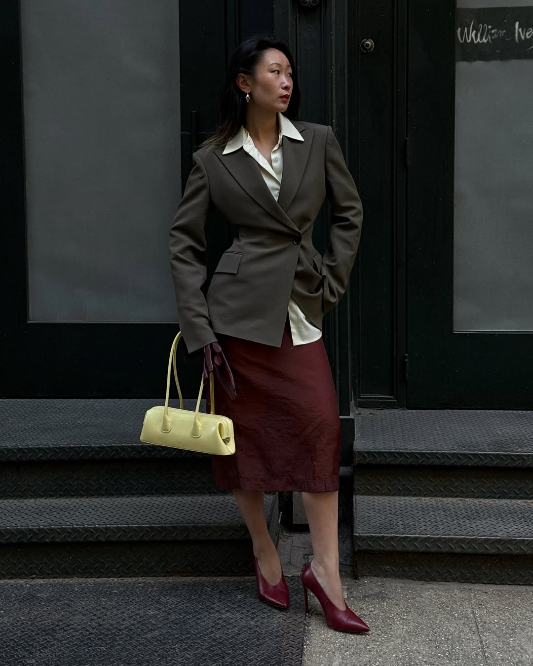 Woman wearing burgundy shoe outfit 2025.