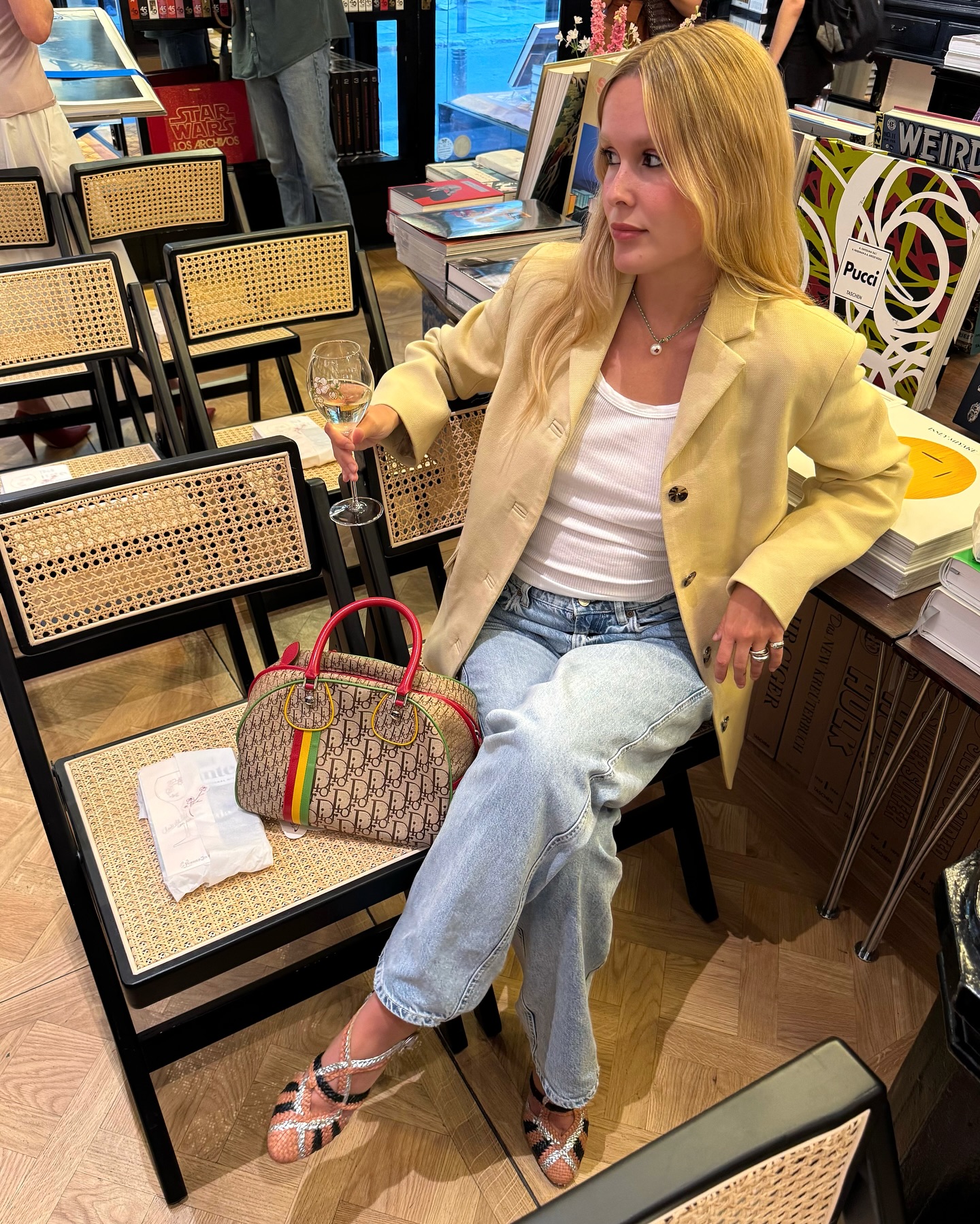 Woman wearing a tan jacket with jeans in a fall 2025 outfit.