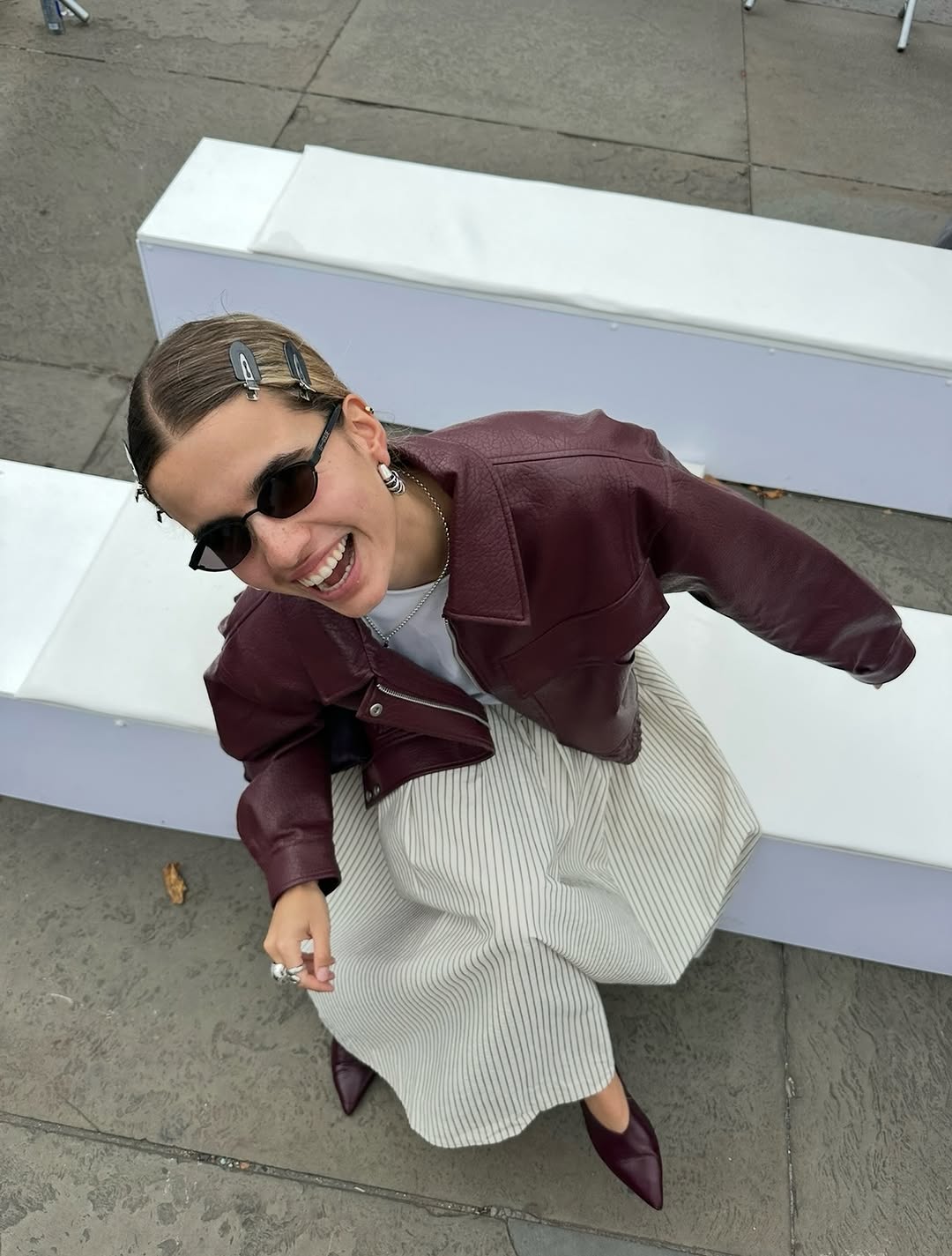 Woman wearing burgundy shoe outfit 2025.