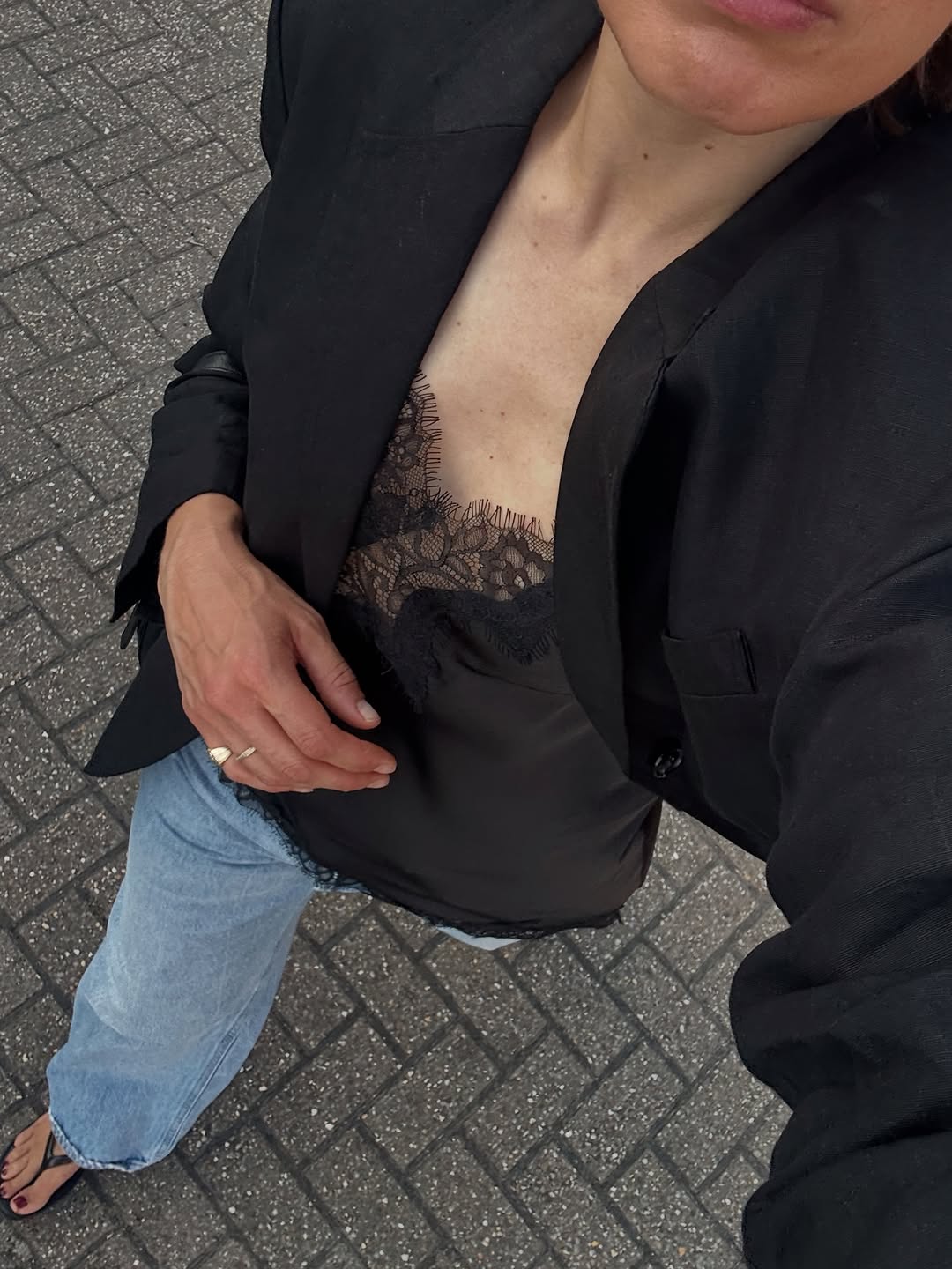 Woman wearing black lace going out top.