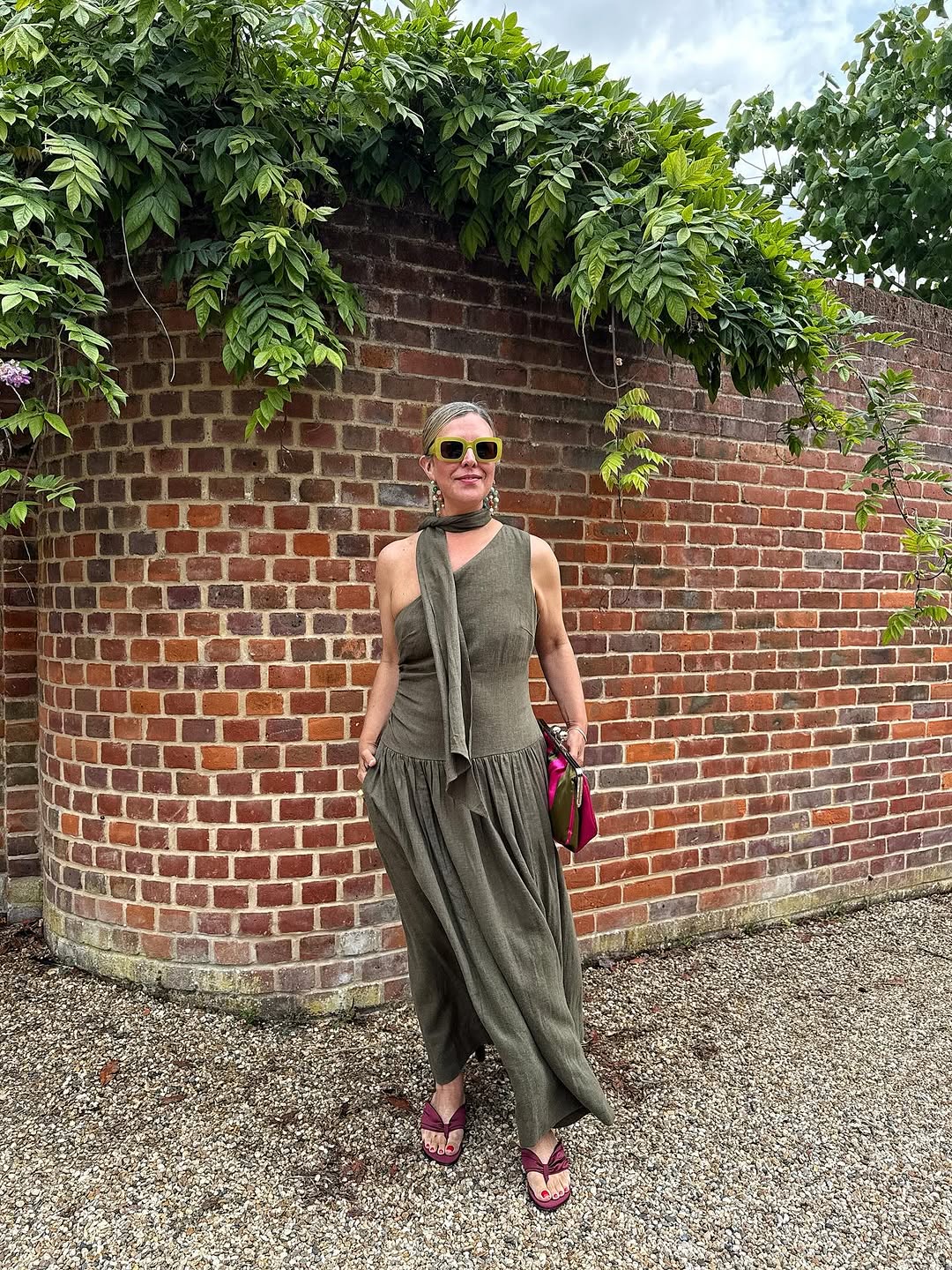 Woman wearing burgundy shoe outfit 2025.