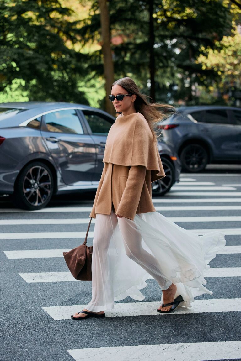 Woman wearing tan outerwear during NYFW S/S 26.