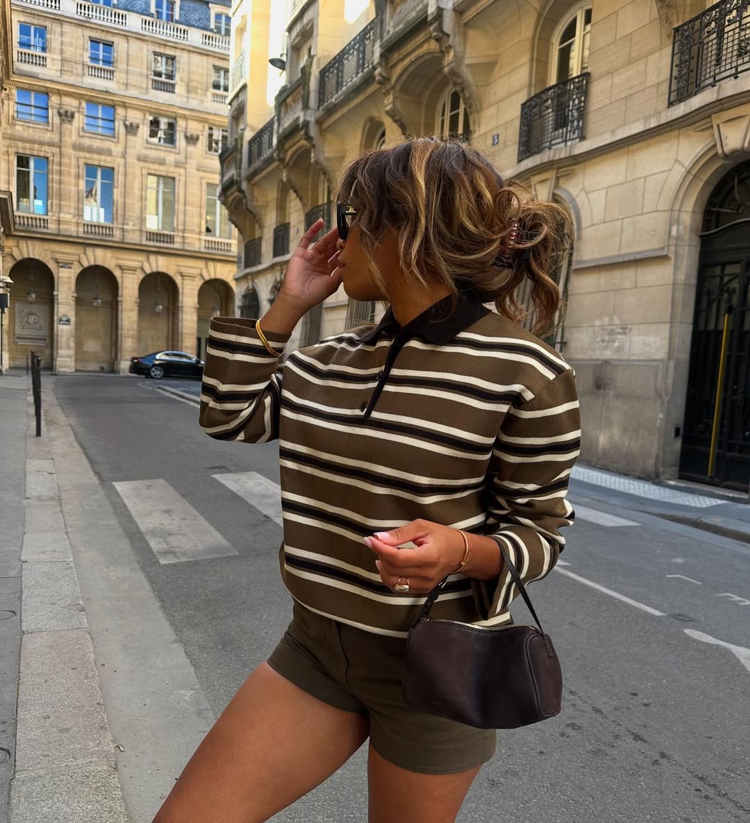 Ellie Delphine in striped polo.