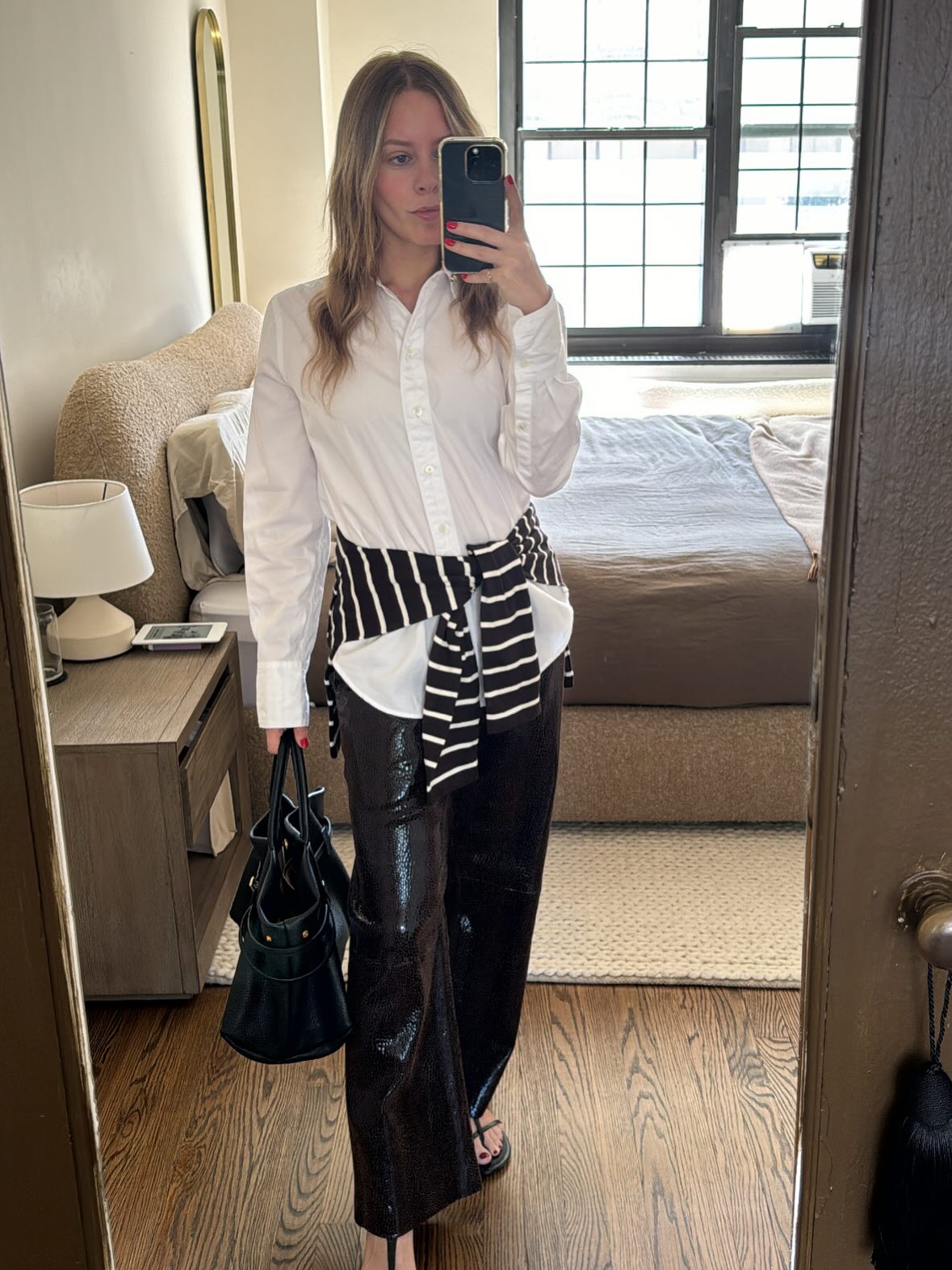 Nikki Chwatt wearing a striped sweater.