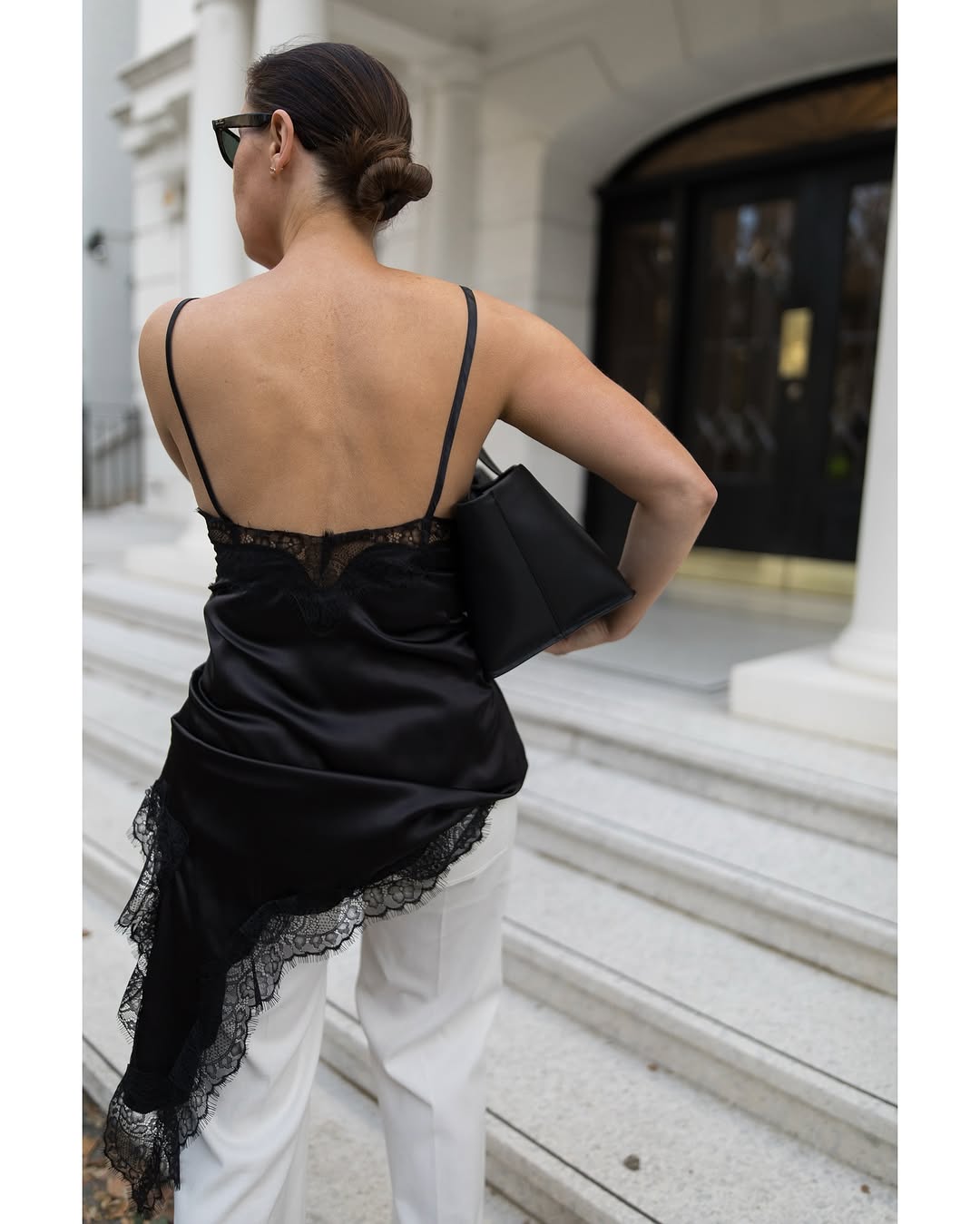 Woman wearing black lace going out top.