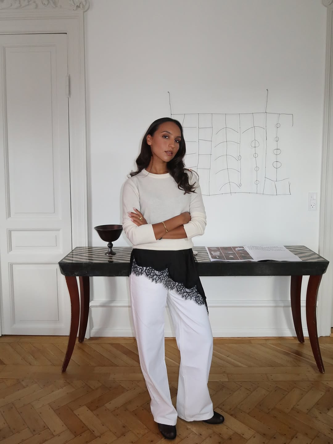 Woman wearing black lace going out top.