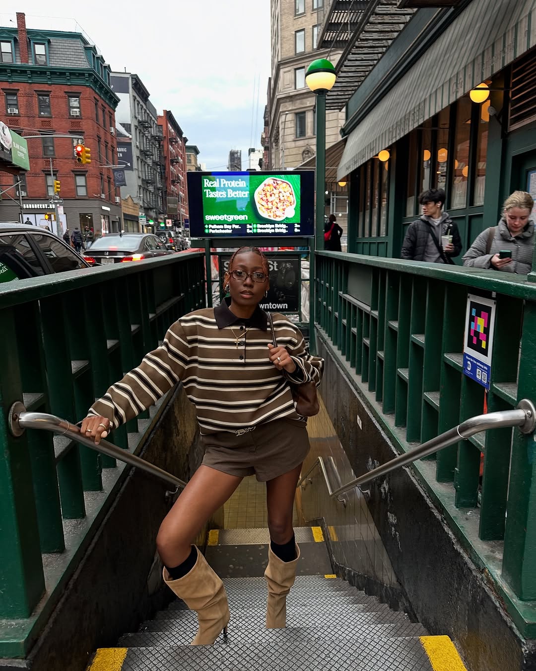 Woman wearing a 2025 slouchy boot outfit.