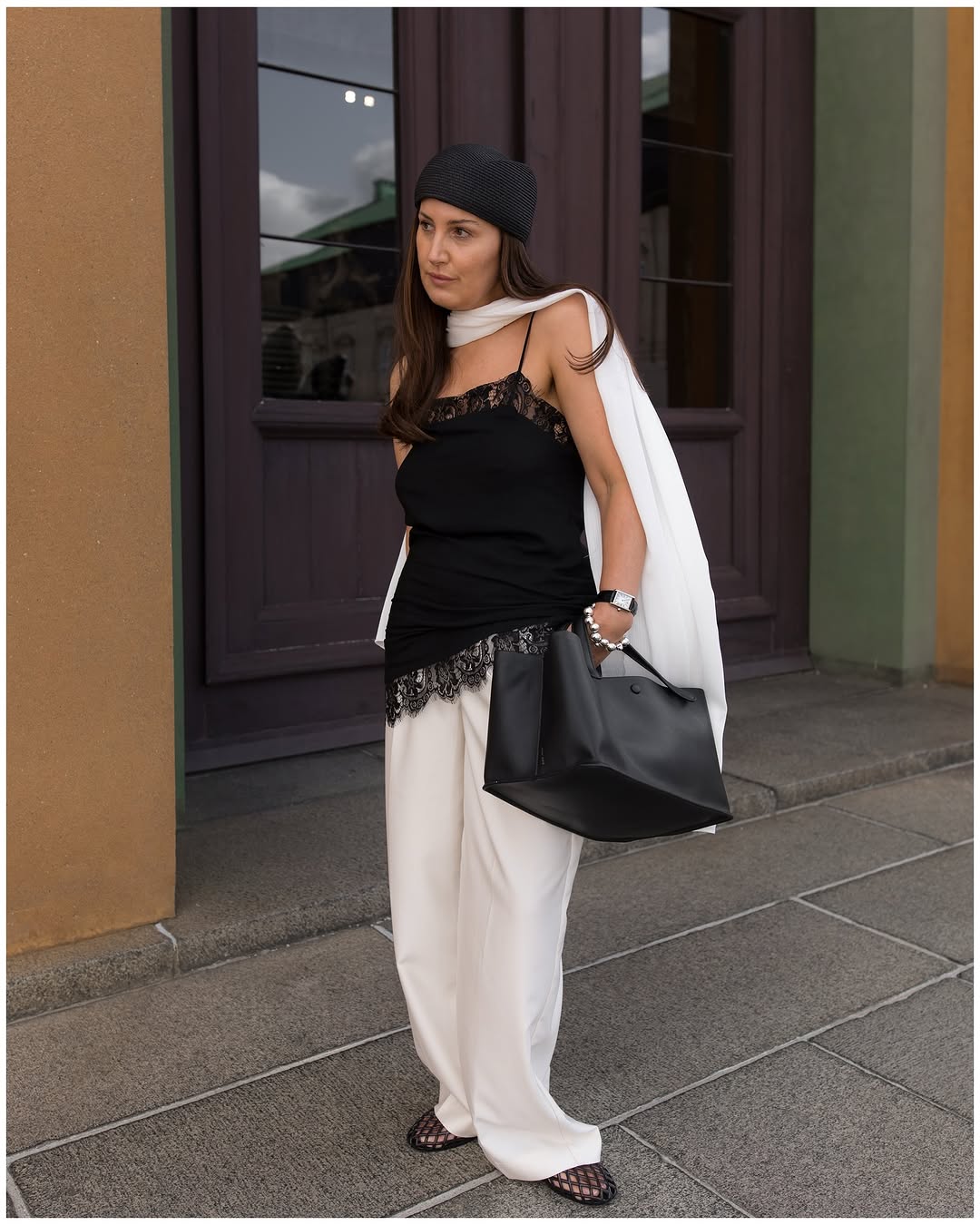 Woman wearing black lace going out top.