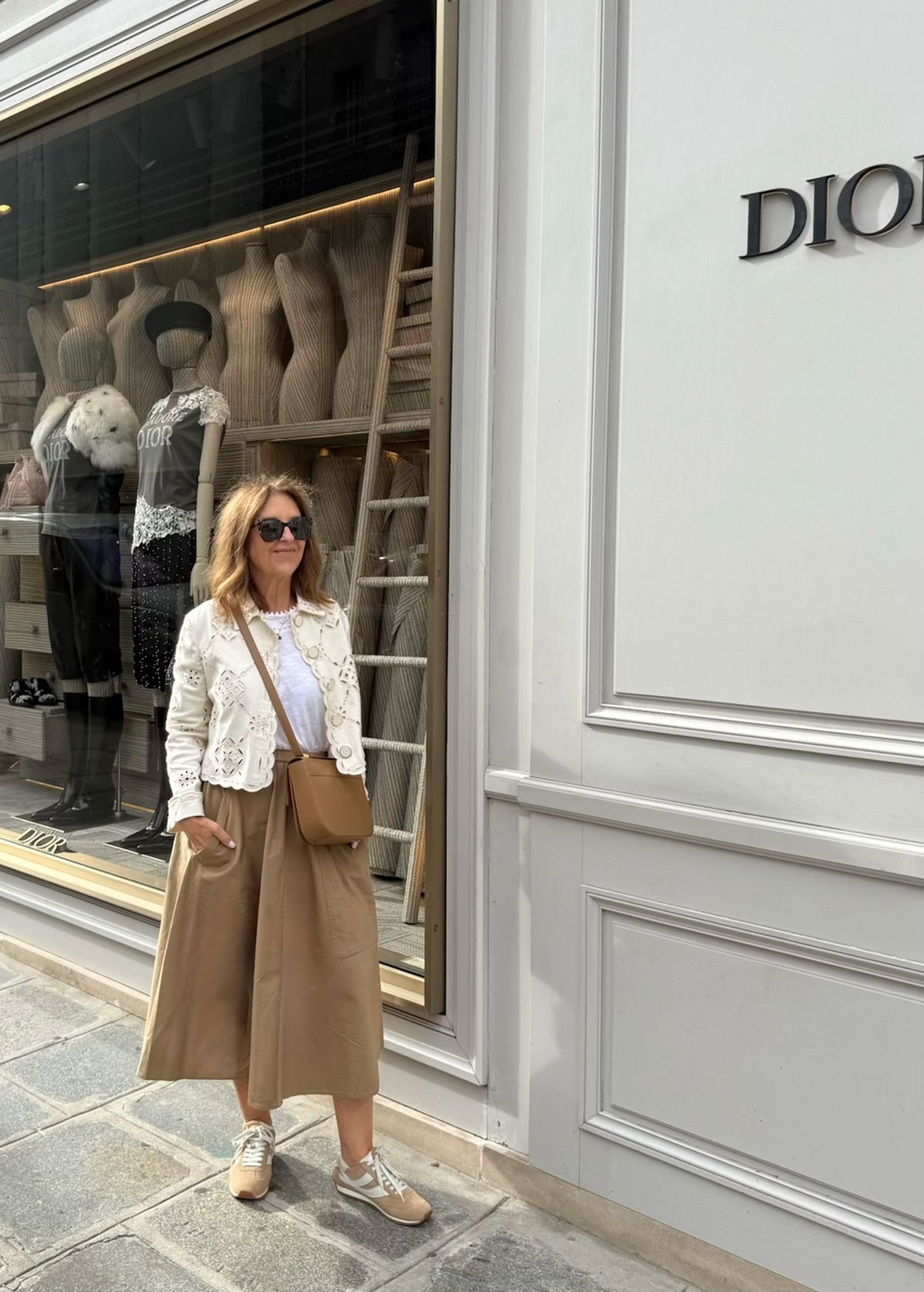 A Nordstrom stylist wearing sneakers in Paris.