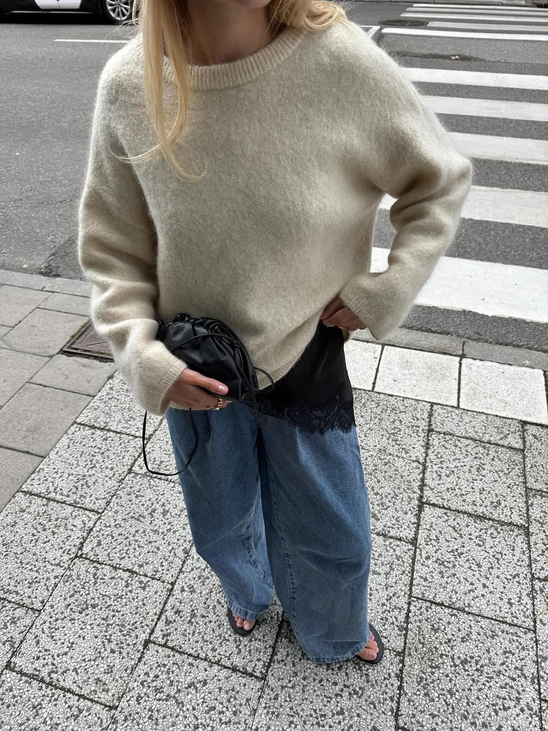 Woman wearing black lace going out top.