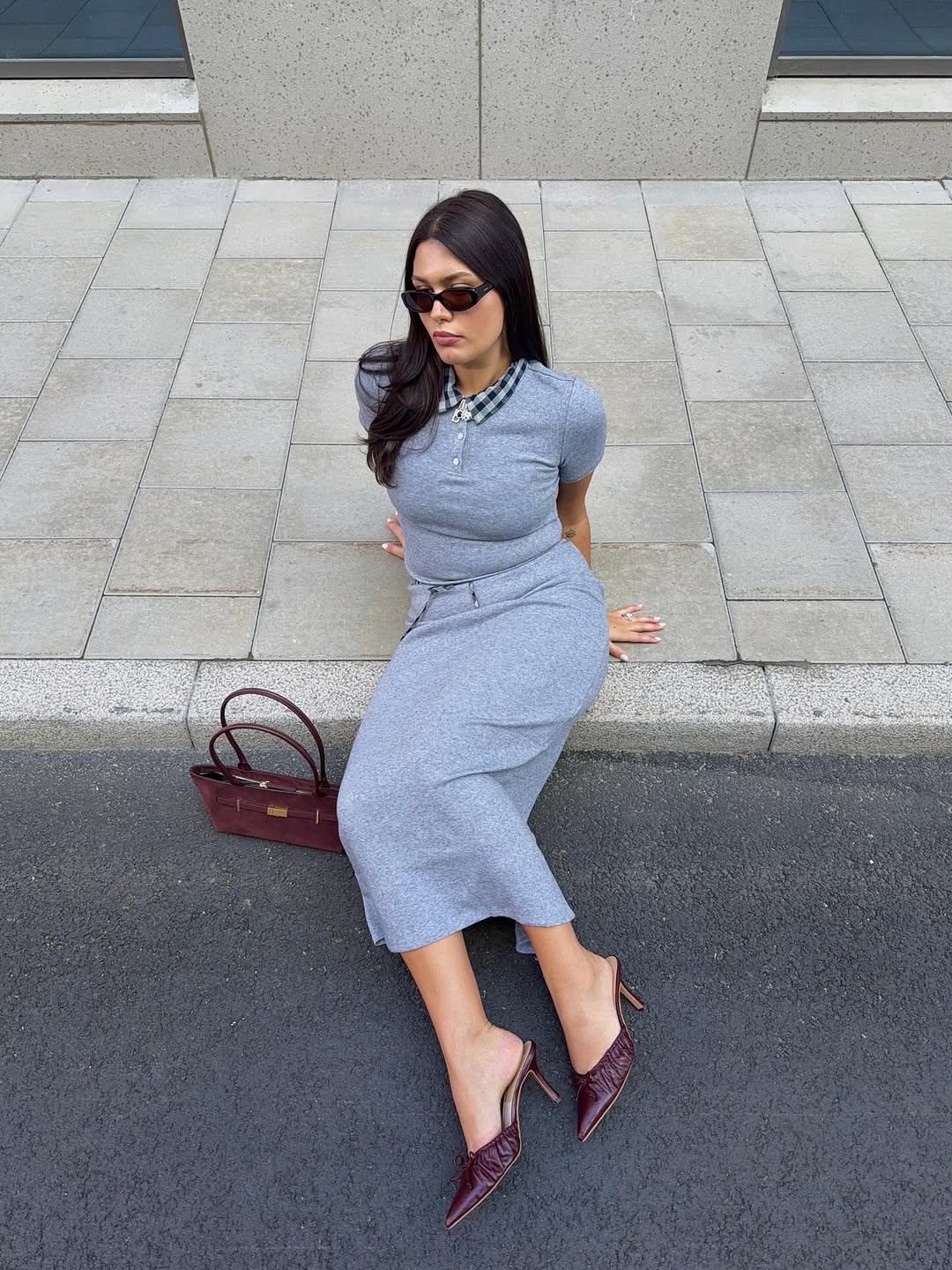 Woman wearing burgundy shoe outfit 2025.