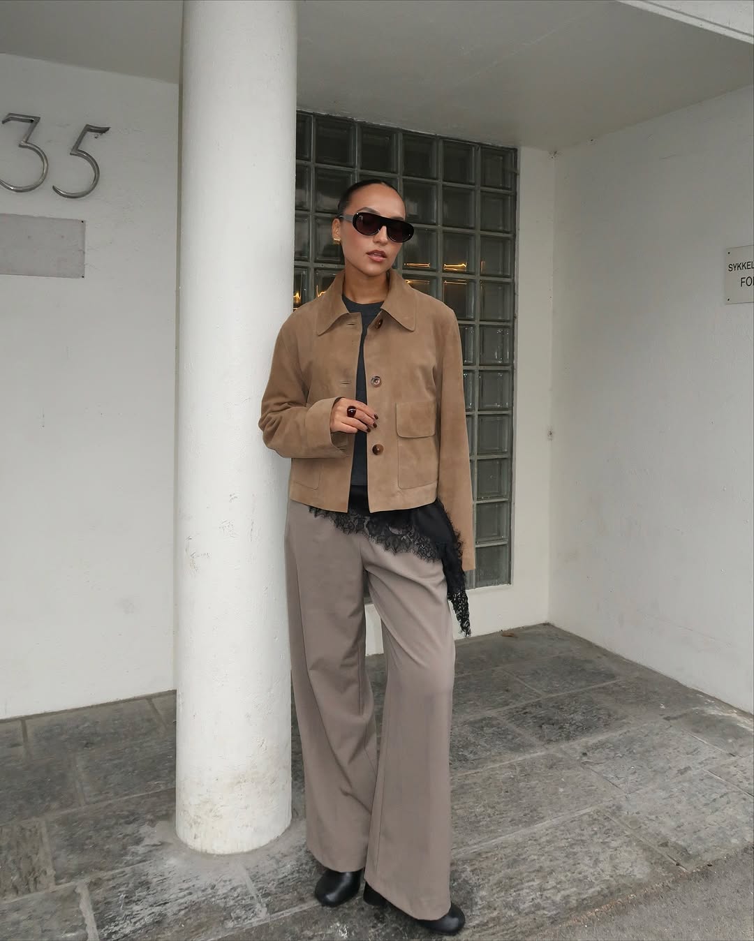 Woman wearing black lace going out top.