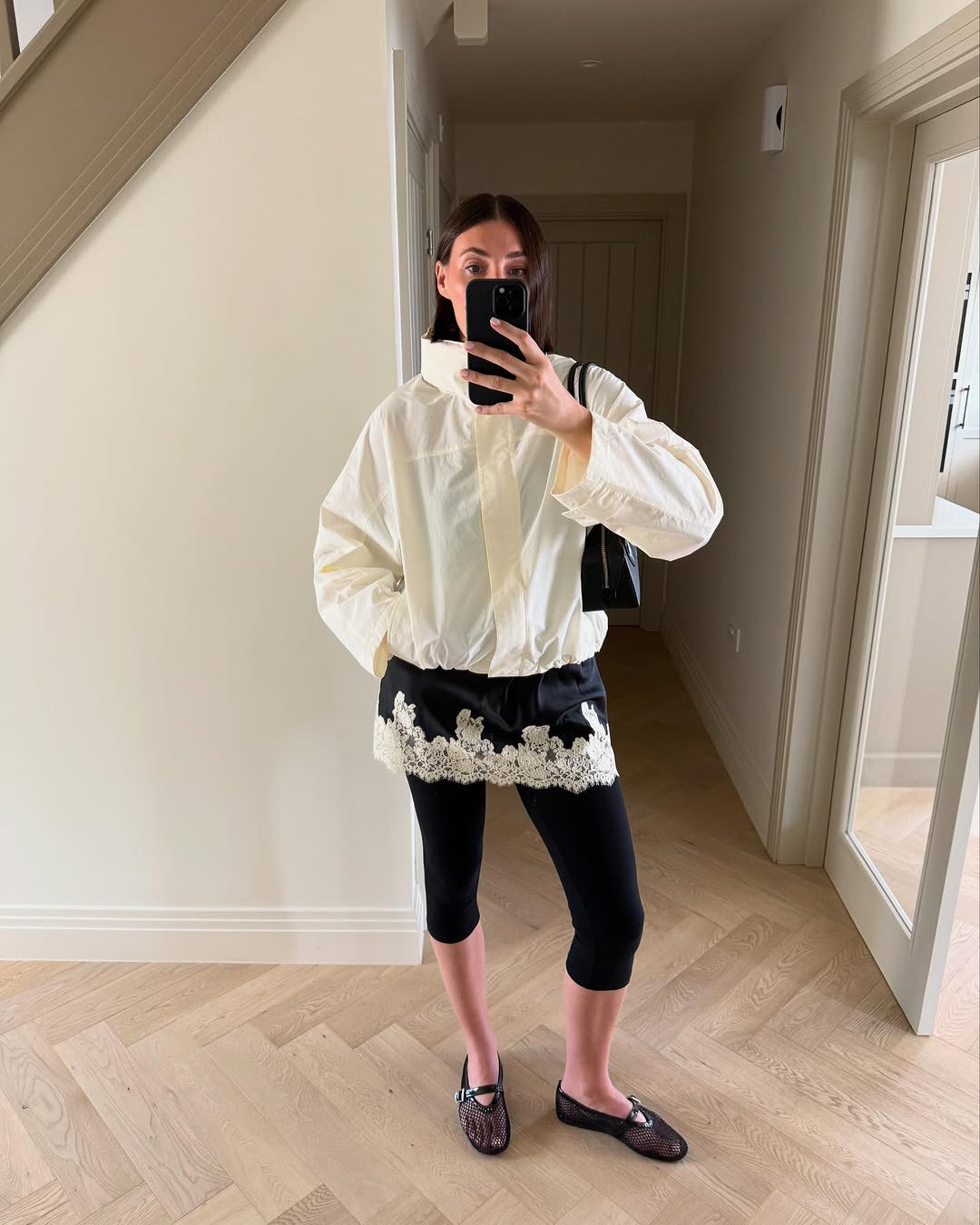 Woman wearing black lace going out top.