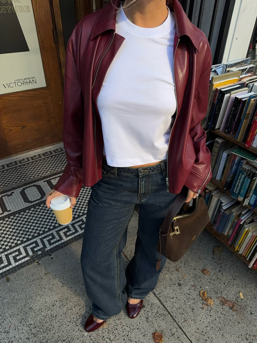 Woman wearing burgundy shoe outfit 2025.