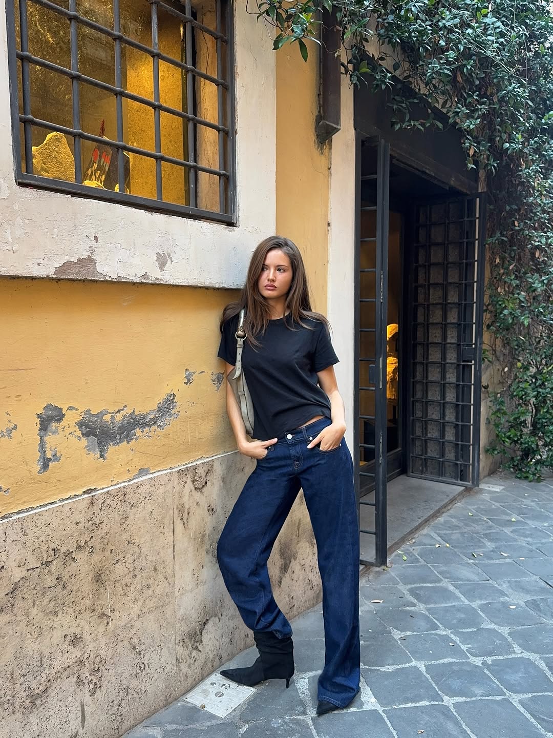 woman wearing suede pointed toe ankle boots trend 2025