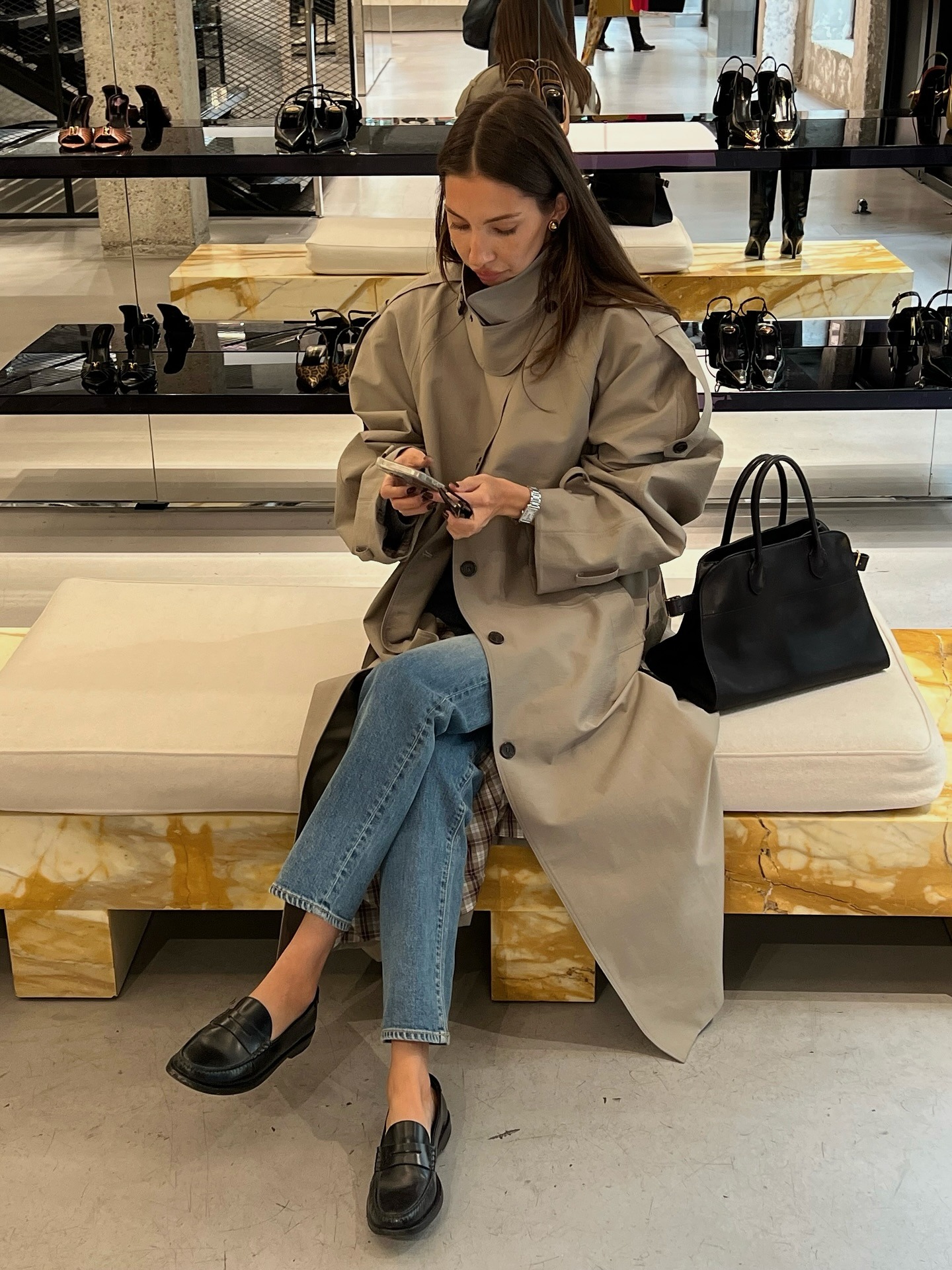 The Paris outfit featuring stylish jeans, a trench coat, and a blazer