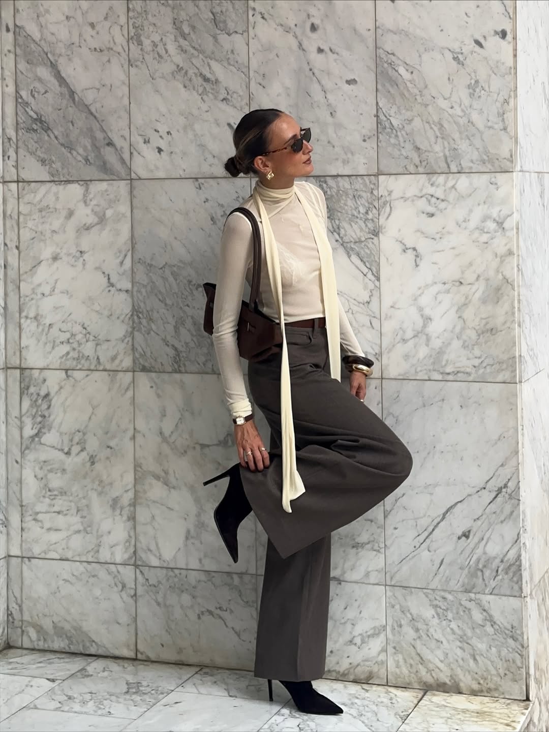 woman wearing suede pointed toe ankle boots trend 2025