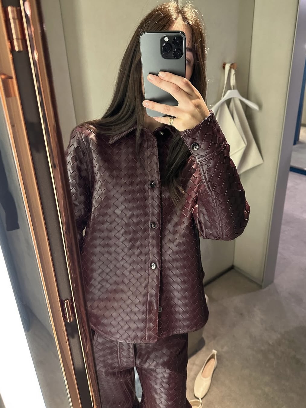 Ilana Torbiner wearing an oxblood leather top and matching pants.