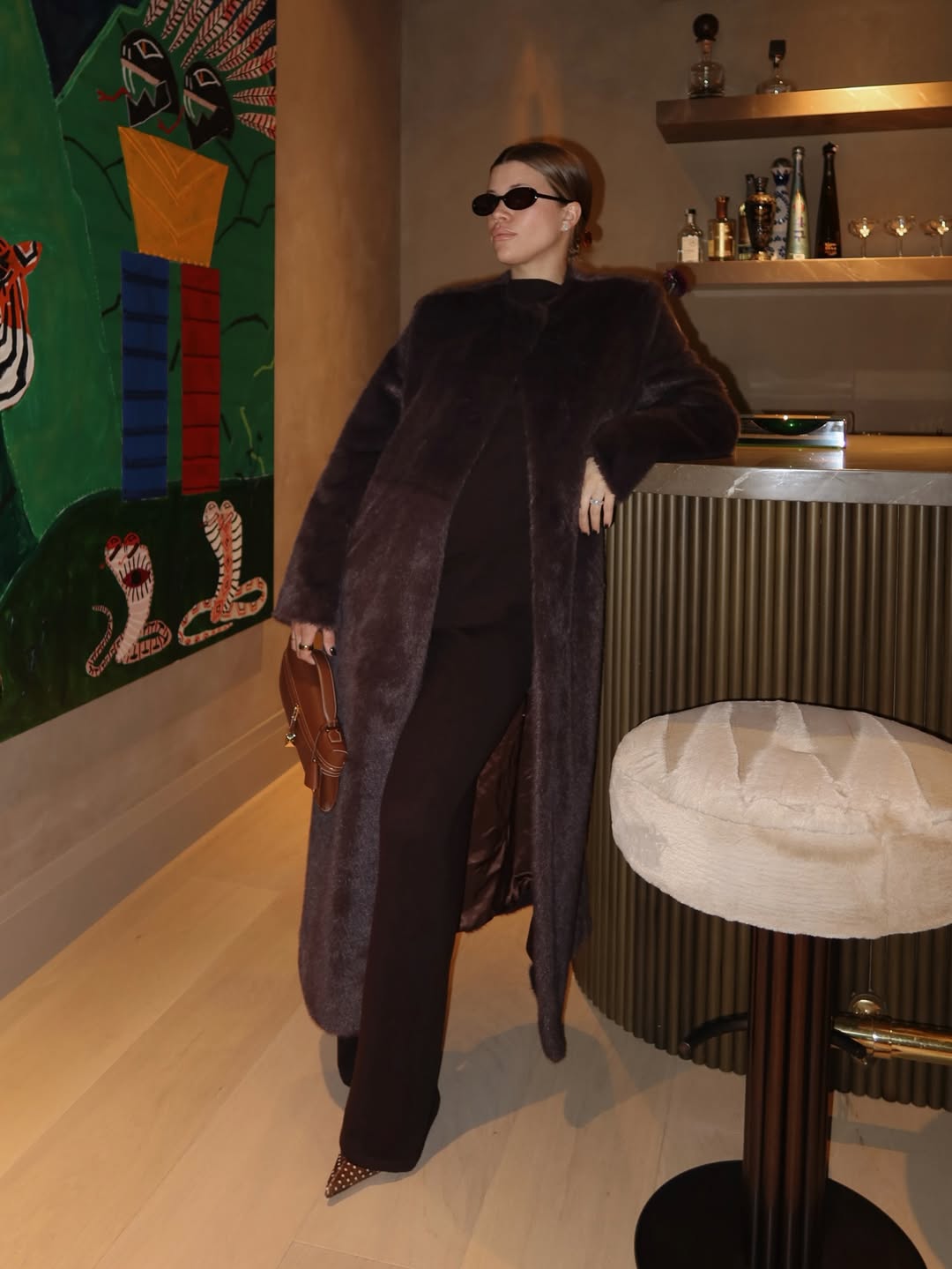 Sofia Richie Grainge wearing a faux fur SRG coat