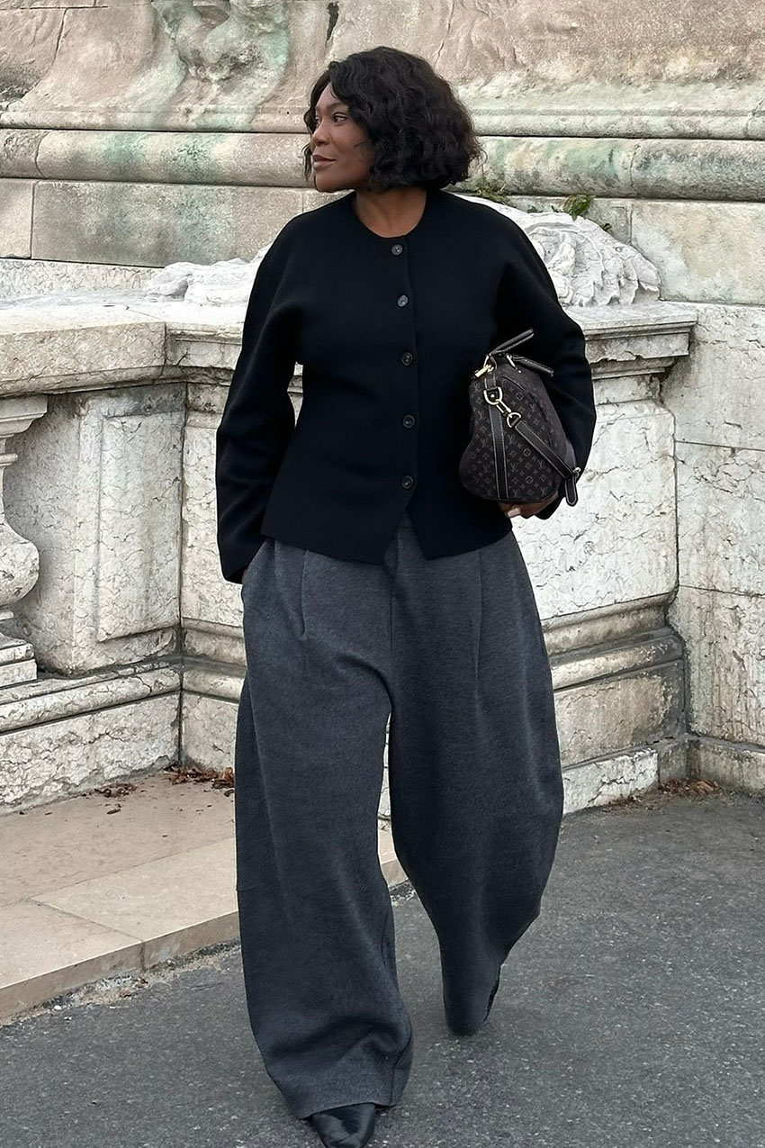 a woman wearing a collarless jacket