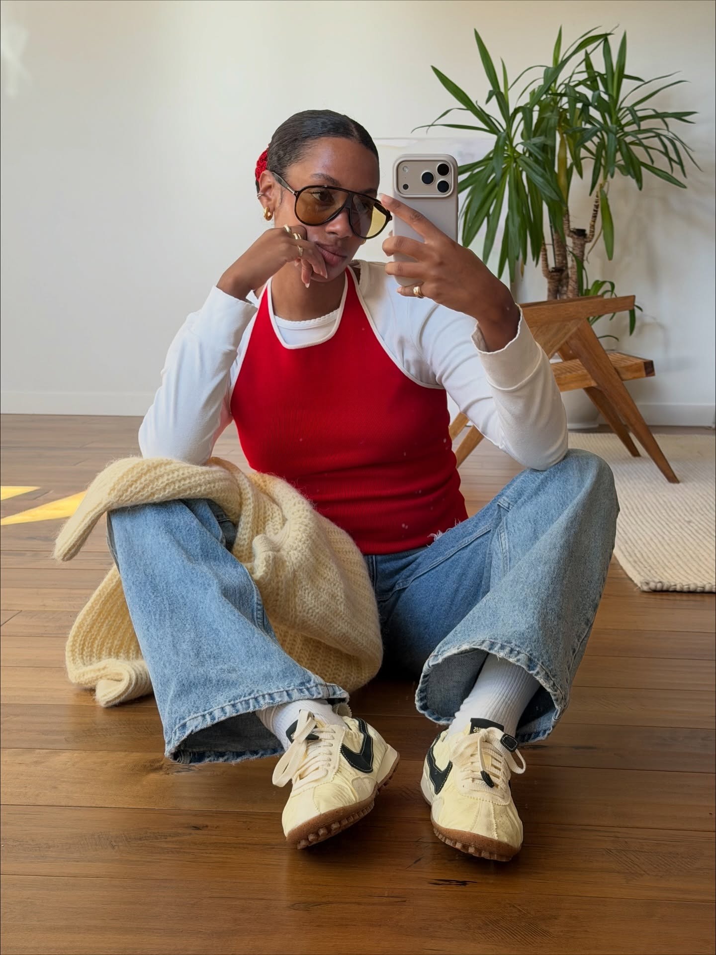 French influencer wearing jeans and a sweater