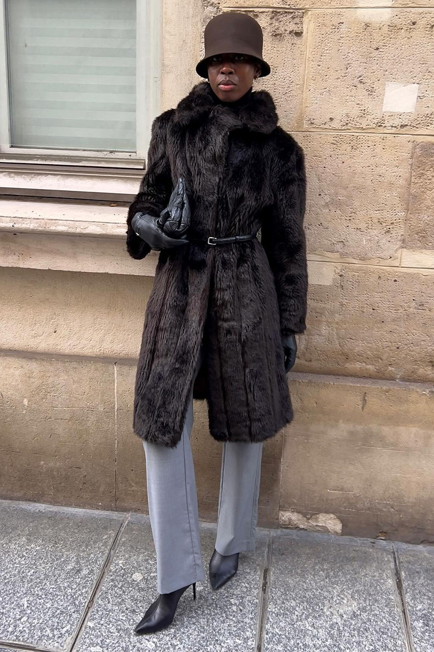 a woman wearing a fur coat