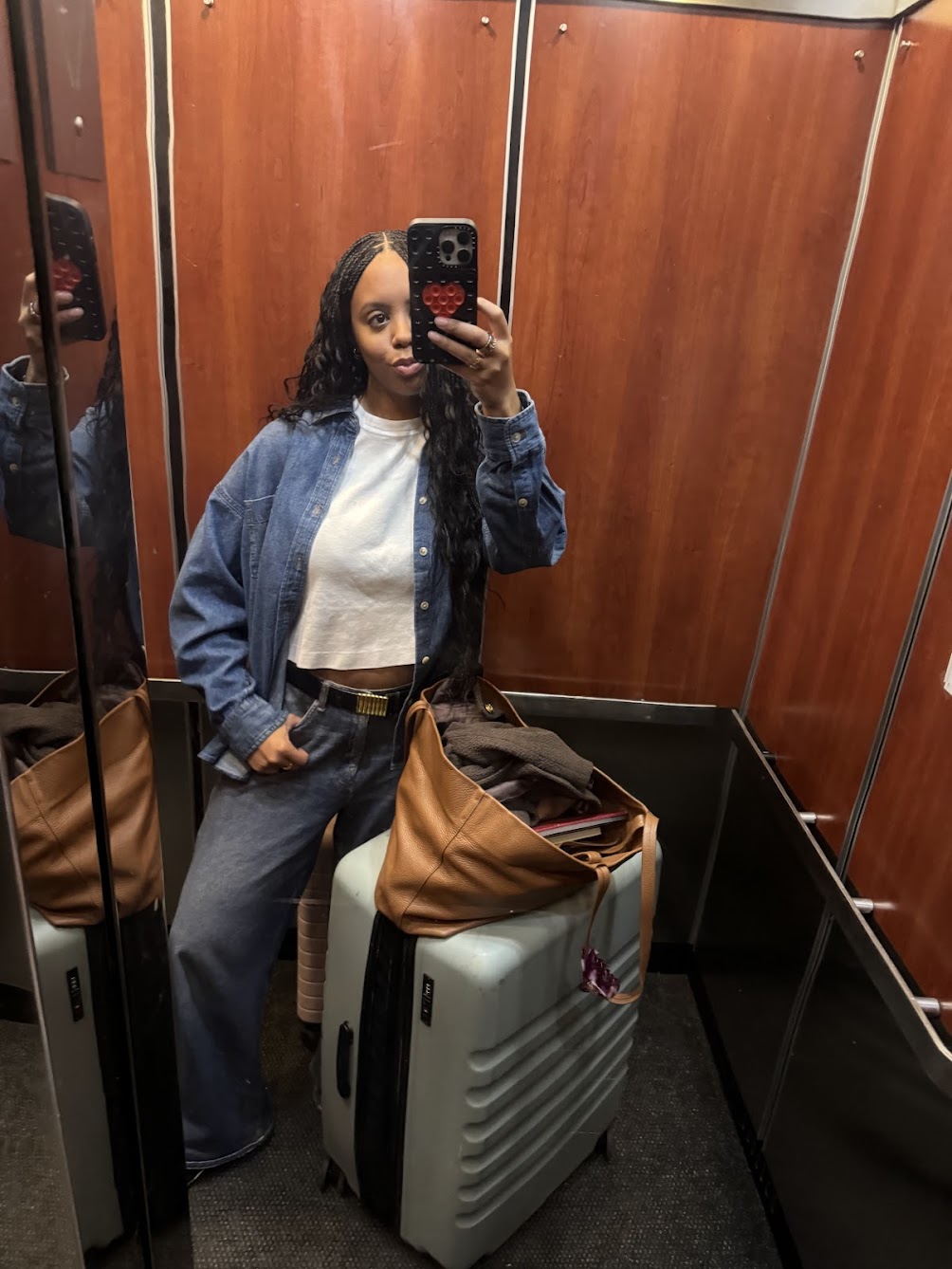 Woman wearing a sweatpant jeans outfit.