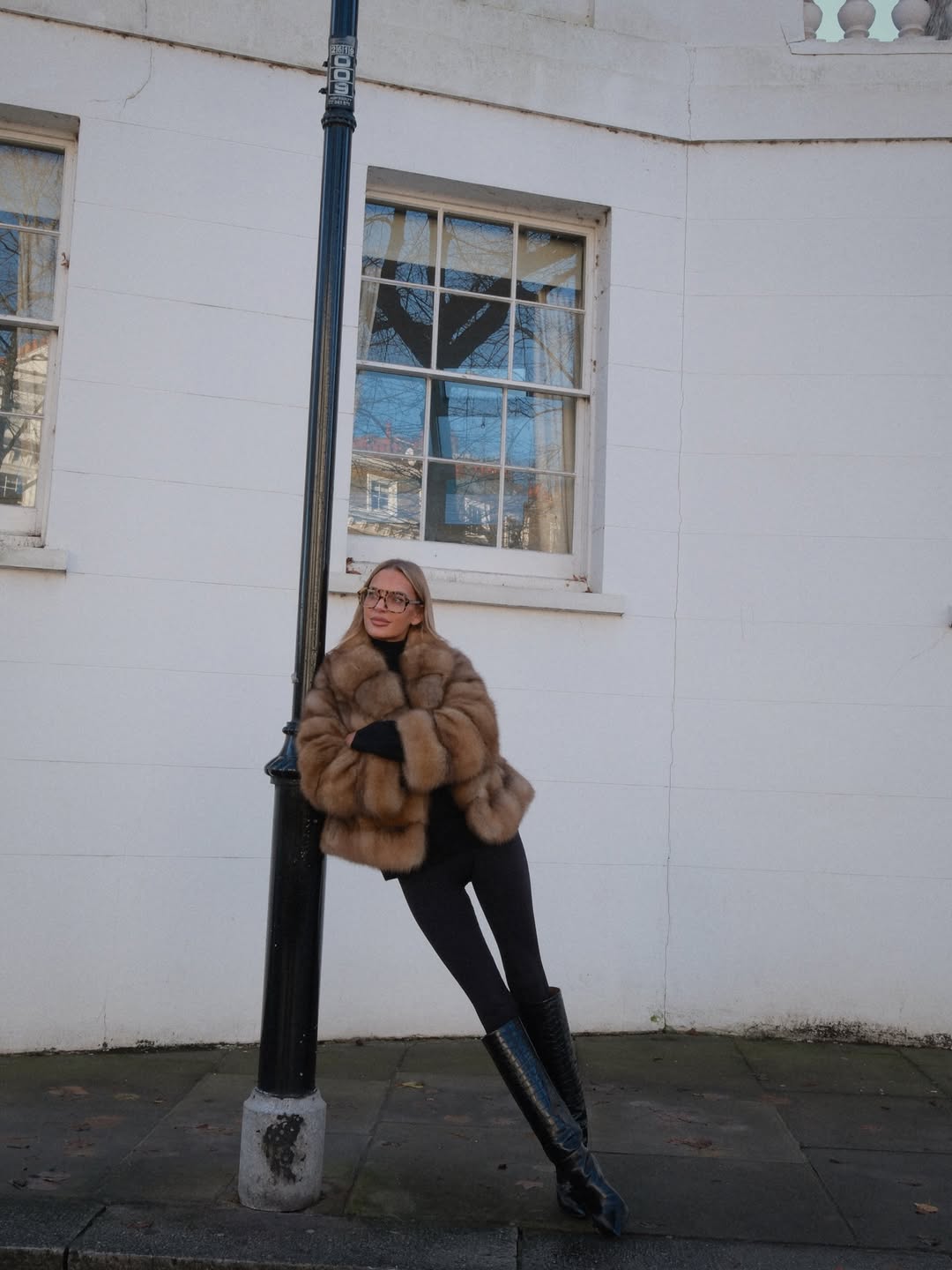 woman wearing leggings with boots outfit 2026