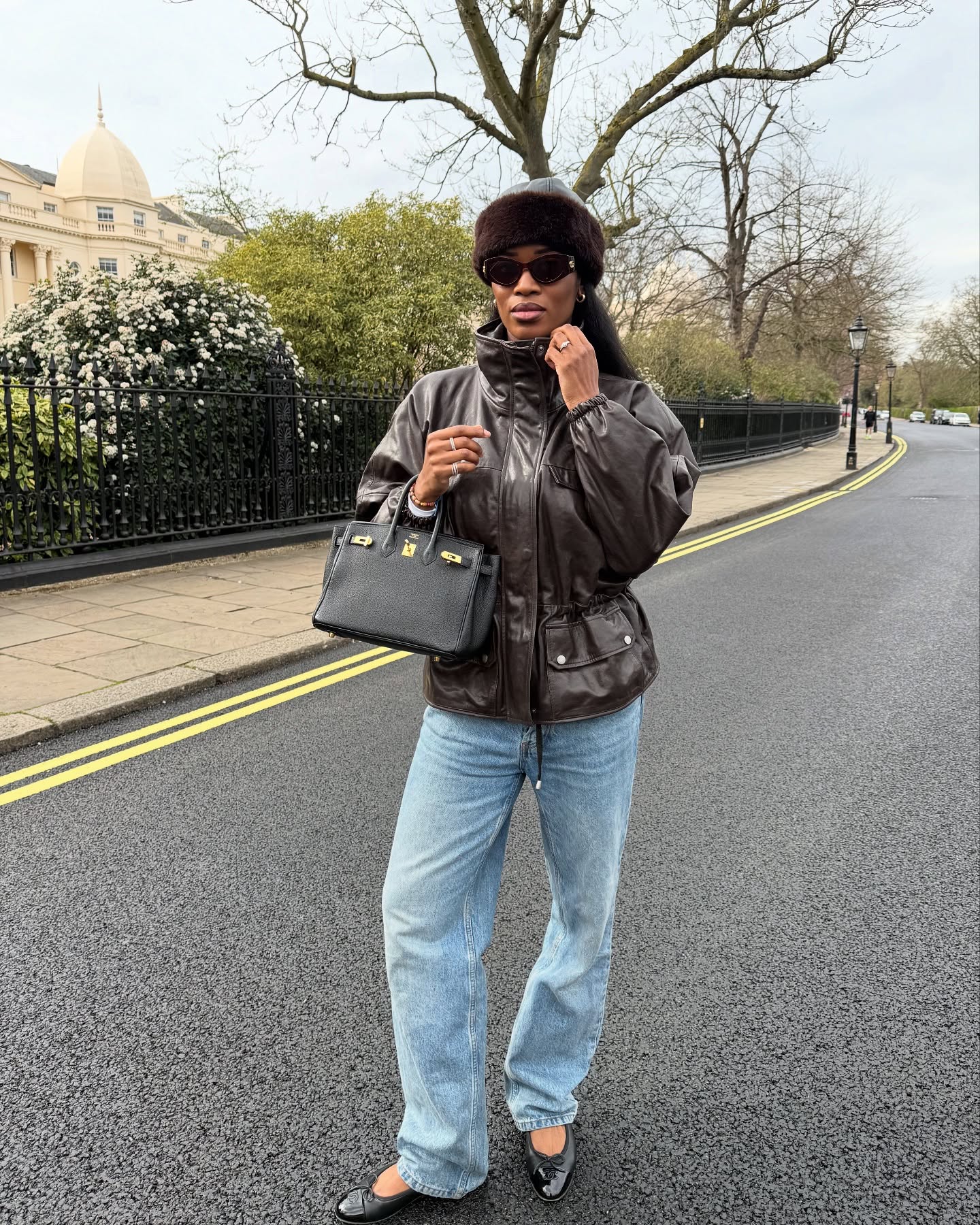 Influencer wearing a cinch-waist leather jacket