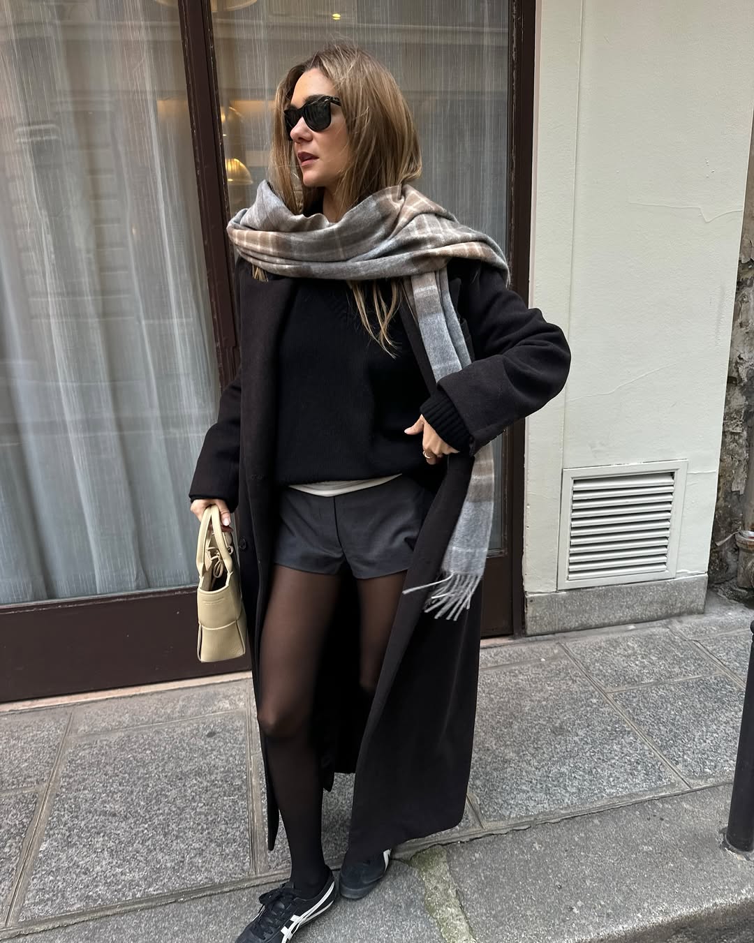 Woman wearing miniskirt with tights outfit 2026.