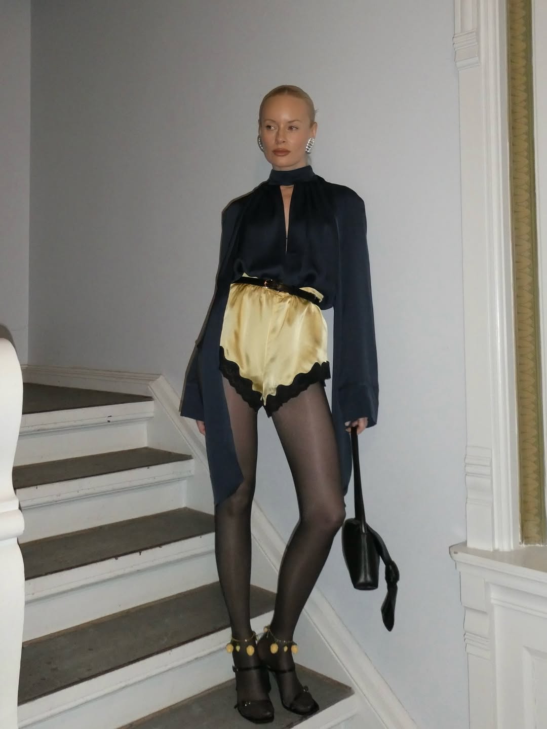 Woman wearing miniskirt with tights outfit 2026.