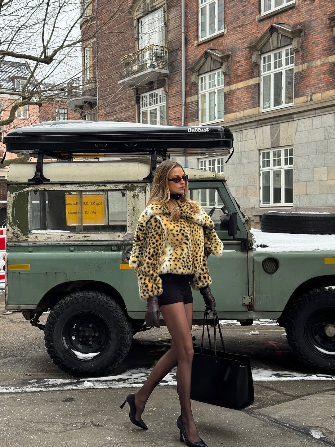 Woman wearing miniskirt with tights outfit 2026.